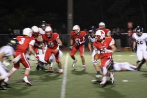 Josh Drwal gains yards on the ground in the third quarter of last Friday's game. Photo By Ethan Woodfill