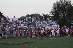 The Avonworth Football Team takes  the field in front of their fans - who successfully pulled off a white-out. Photo by Ethan Woodfill