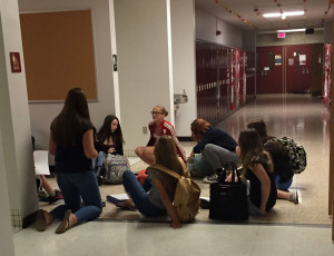 Mrs. Maisner's Honors World Geo class used the lighting from the backup generators to continue with class, as scenes like this appeared throughout the hallways of the high school. 